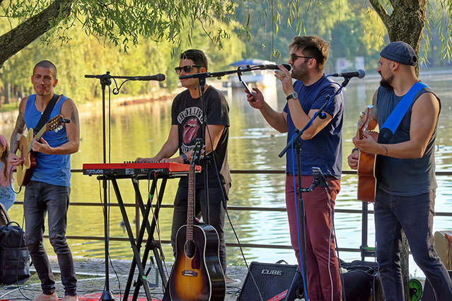 A small amateur band playing outdoors