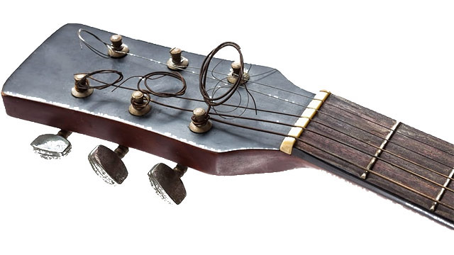 Guitar headstock with uncut strings made into loops